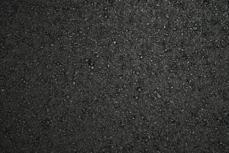 Close-up of the surface texture of freshly compacted asphalt