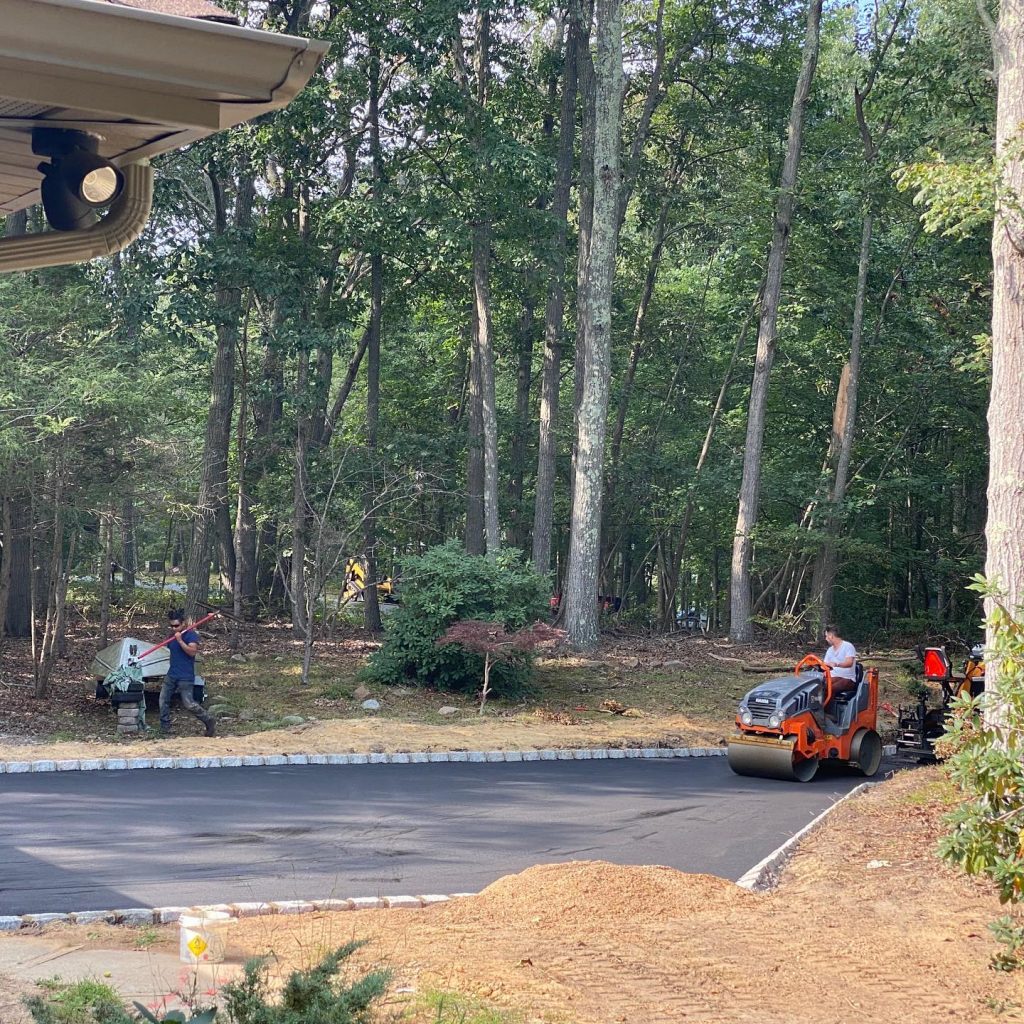 Dan the Paver team working on the asphalt driveway project.